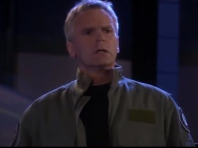 Richard Anderson is wearing a green jacket in the picture.